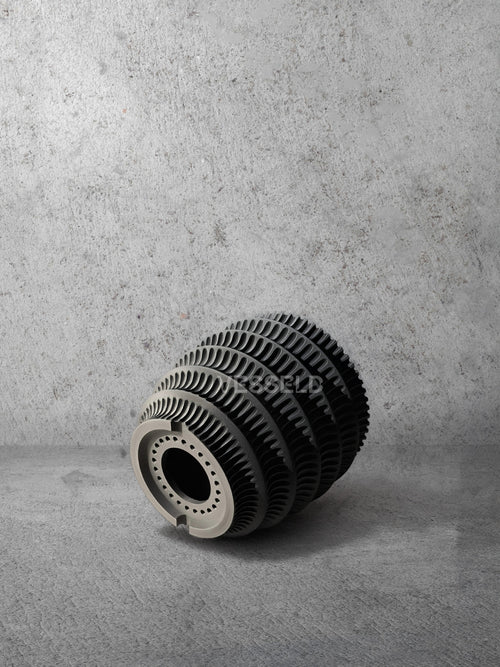 Vesseld.com Bottom of 3D Printed Textured Design Black Cylindrical Planter on a gray concrete background