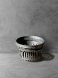 Vesseld.com 3D Printed Pot with textured design on a gray surface