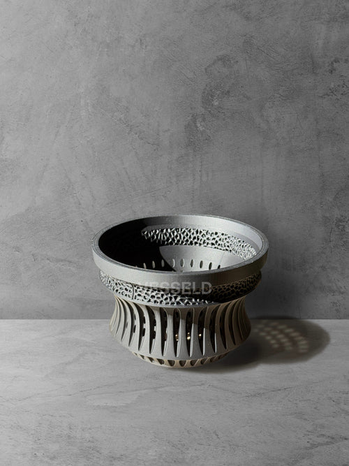 Vesseld.com 3D Printed Pot with textured design on a gray surface