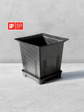 Vesseld Drain Smart Black square planter on a gray surface with an iF Design Award 2024 logo.