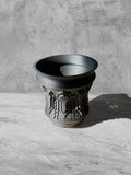 Vesseld.com 3D Printed Pot with textured design on a gray surface