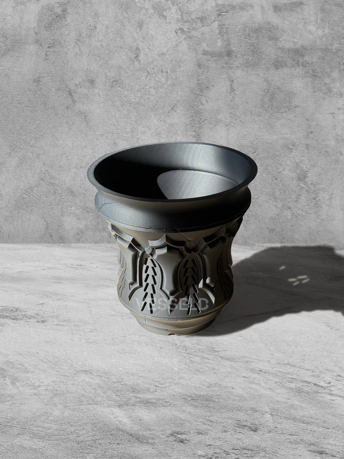 Vesseld.com 3D Printed Pot with textured design on a gray surface