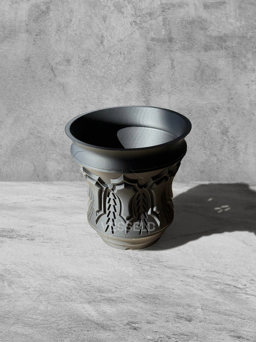 Vesseld.com 3D Printed Pot with textured design on a gray surface