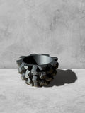 Vesseld.com 3D Printed Textured Design Black Round Planter on a gray surface