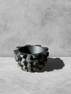 Vesseld.com 3D Printed Textured Design Black Round Planter on a gray surface