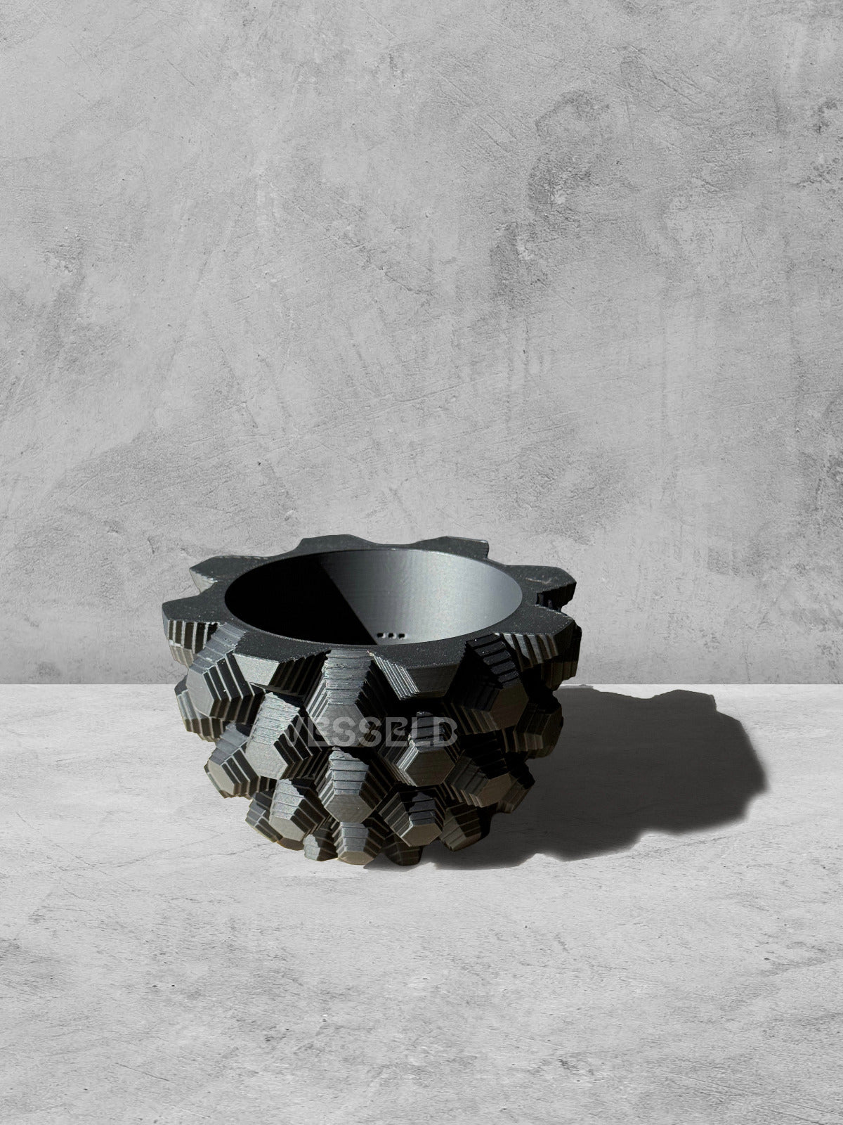 Vesseld.com 3D Printed Textured Design Black Round Planter on a gray surface