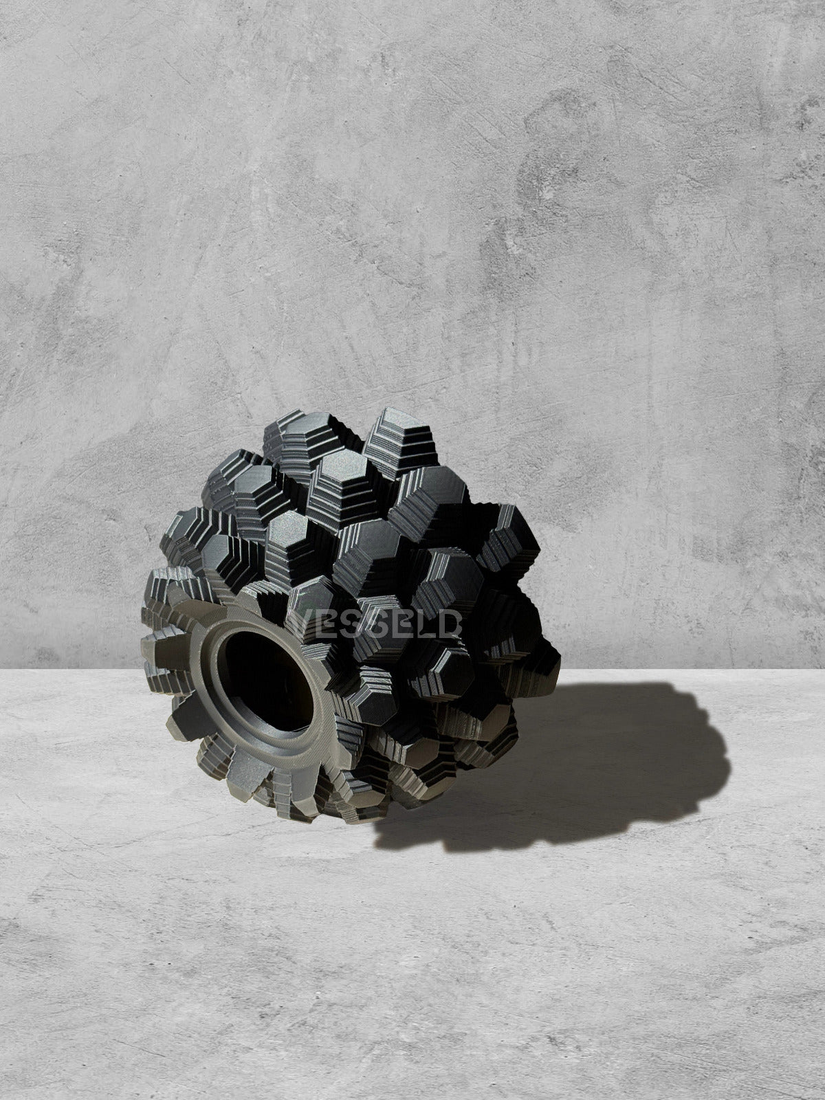 Vesseld.com 3D Printed Textured Design Black Round Planter on a gray surface