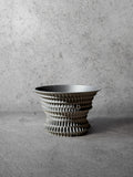 Vesseld.com 3D Printed Planter with textured design on a gray surface