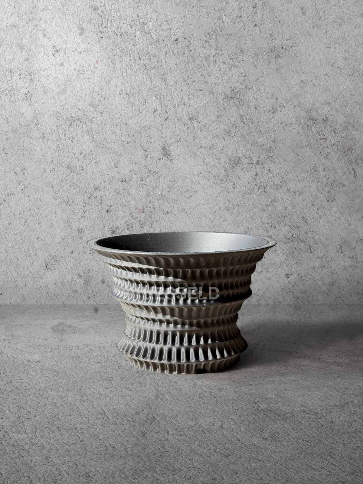 Vesseld.com 3D Printed Planter with textured design on a gray surface