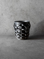 Vesseld.com Black textured 3D Printed Cylindrical Planter on a concrete surface