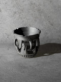 Vesseld.com 3D Printed Black Planter with fangs on a gray surface