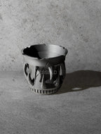 Vesseld.com 3D Printed Black Planter with fangs on a gray surface